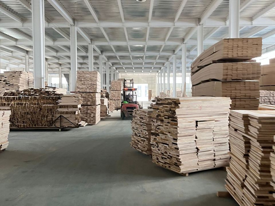 DL Moulding factory storage aisle with stacked wood stock