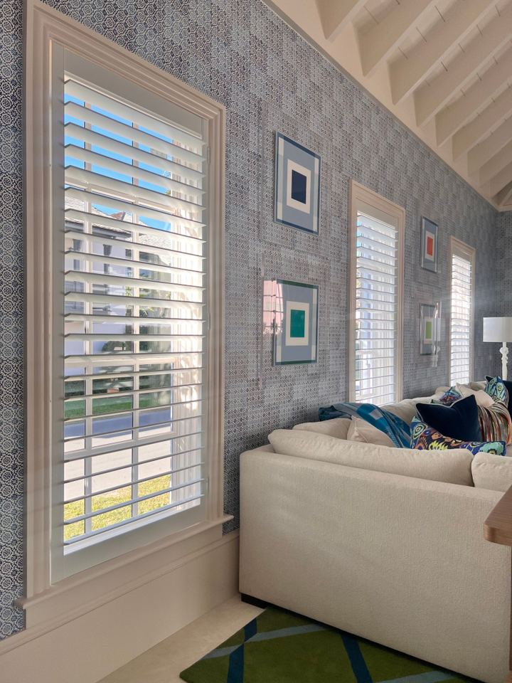 Plantation shutter components in a finished interior window setting