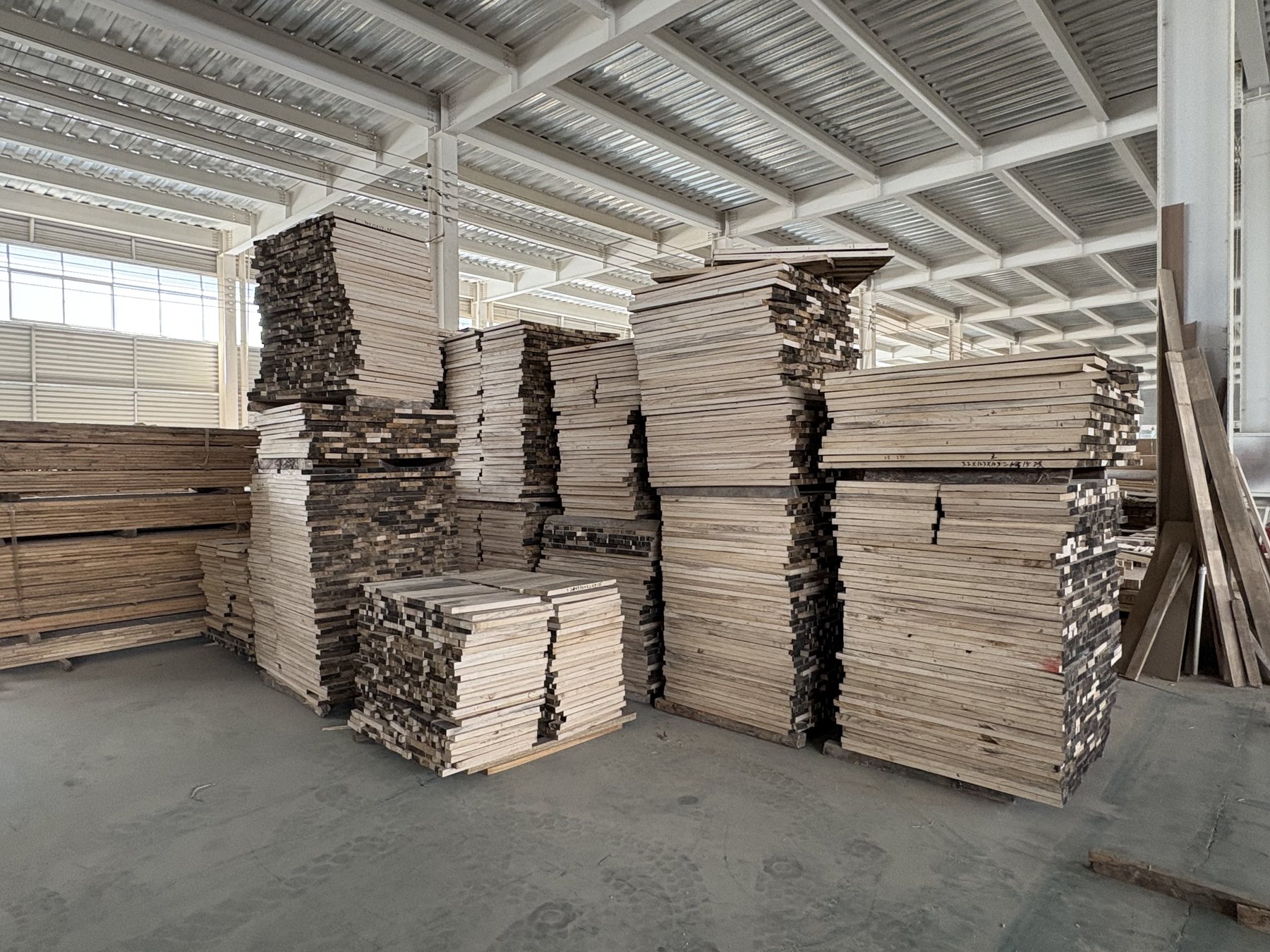 DL Moulding factory area with stacked raw material and millwork stock